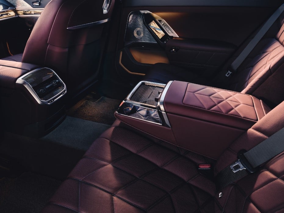 The maroon and black interior of a new BMW.