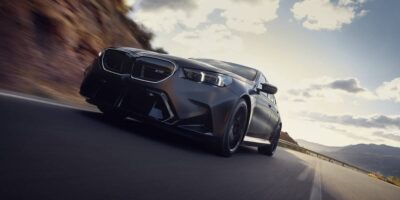 2025 BMW M4 low-profile shot with desert/mountain background