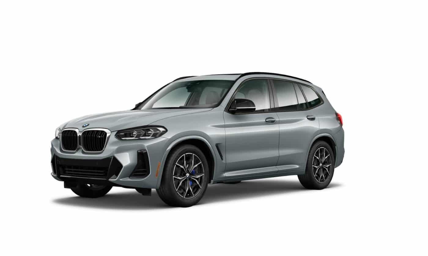 A sleek exterior shot of the BMW X3 M40i in a stylish metallic gray finish, showcasing its bold front grille and aerodynamic SUV design.