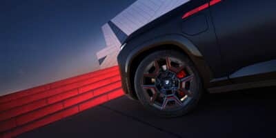 Close-up of BMW wheel and red caliper highlighting BMW Brakes performance design with M details.